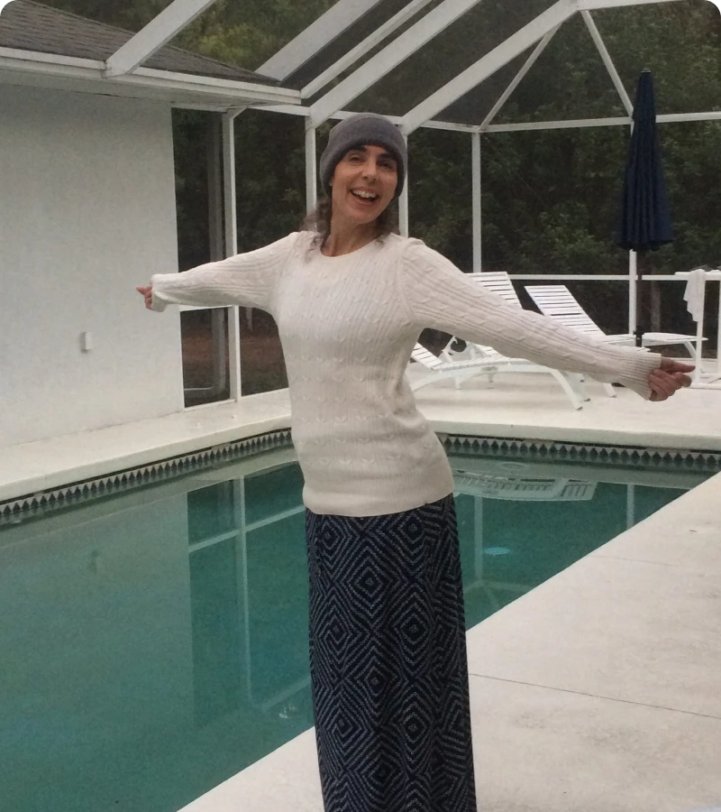 Woman smiling by a pool